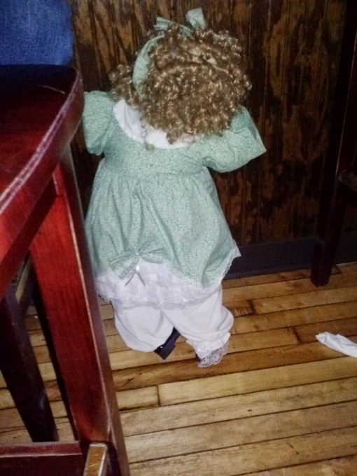 Penelope Anne hiding under a table