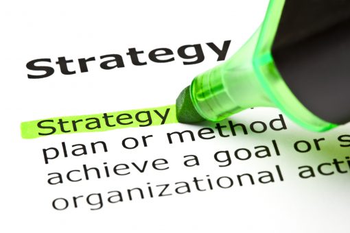 The word 'Strategy' highlighted in green with felt tip pen